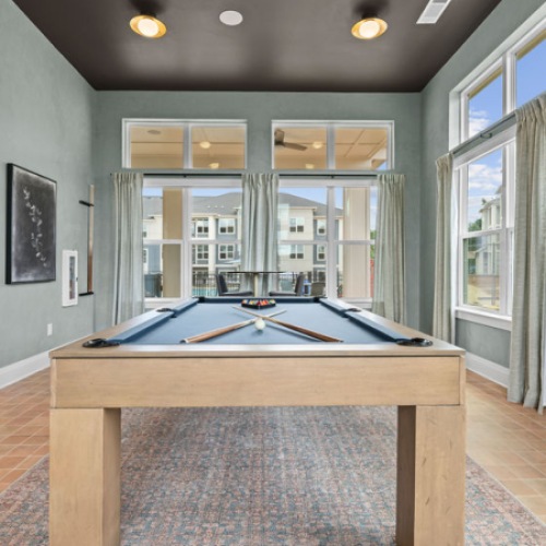 game room with a pool table and shuffleboard