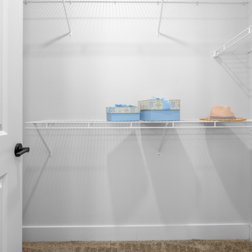 spacious walk-in closet with wire shelving
